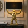 Handgefertigte Tischlampe KING APE 70cm schwarz gold Stoffschirm Affen-Skulptur